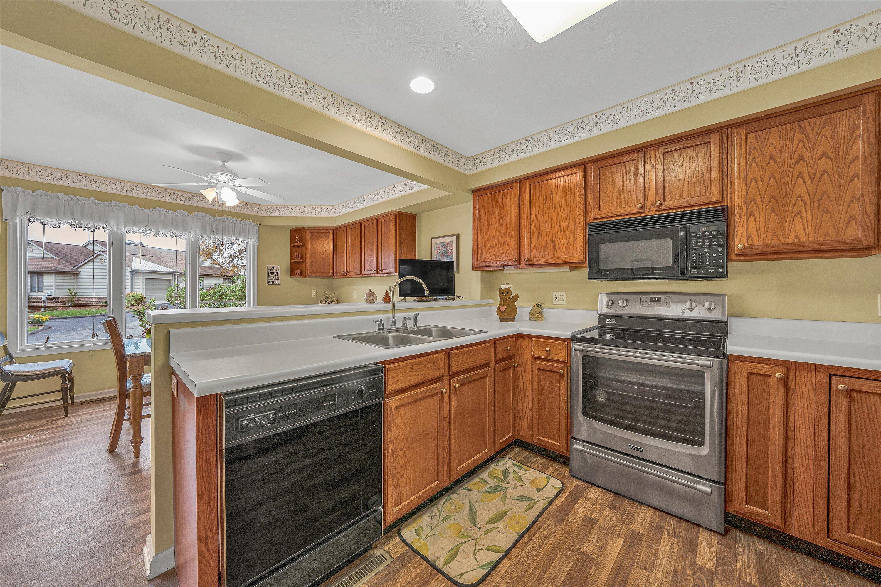 56 Scarlet Street Hardy, VA 24101 - Photo 9 of 42 a kitchen with stainless steel appliances granite countertop a stove a sink and a microwave