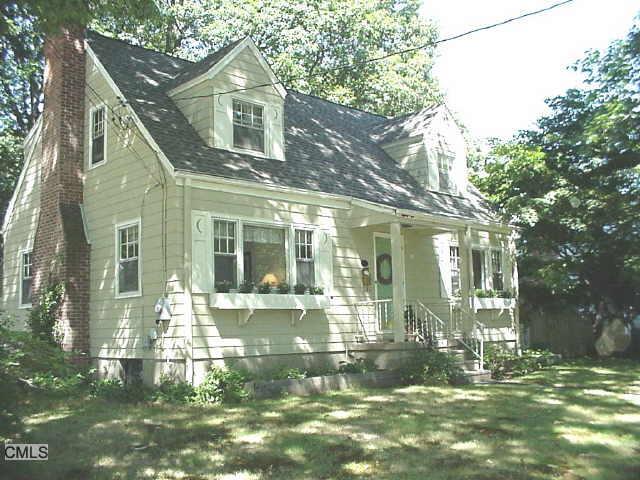 88 Cottage Street Trumbull, CT 06611 - Photo 1 of 1 a front view of a house with a yard