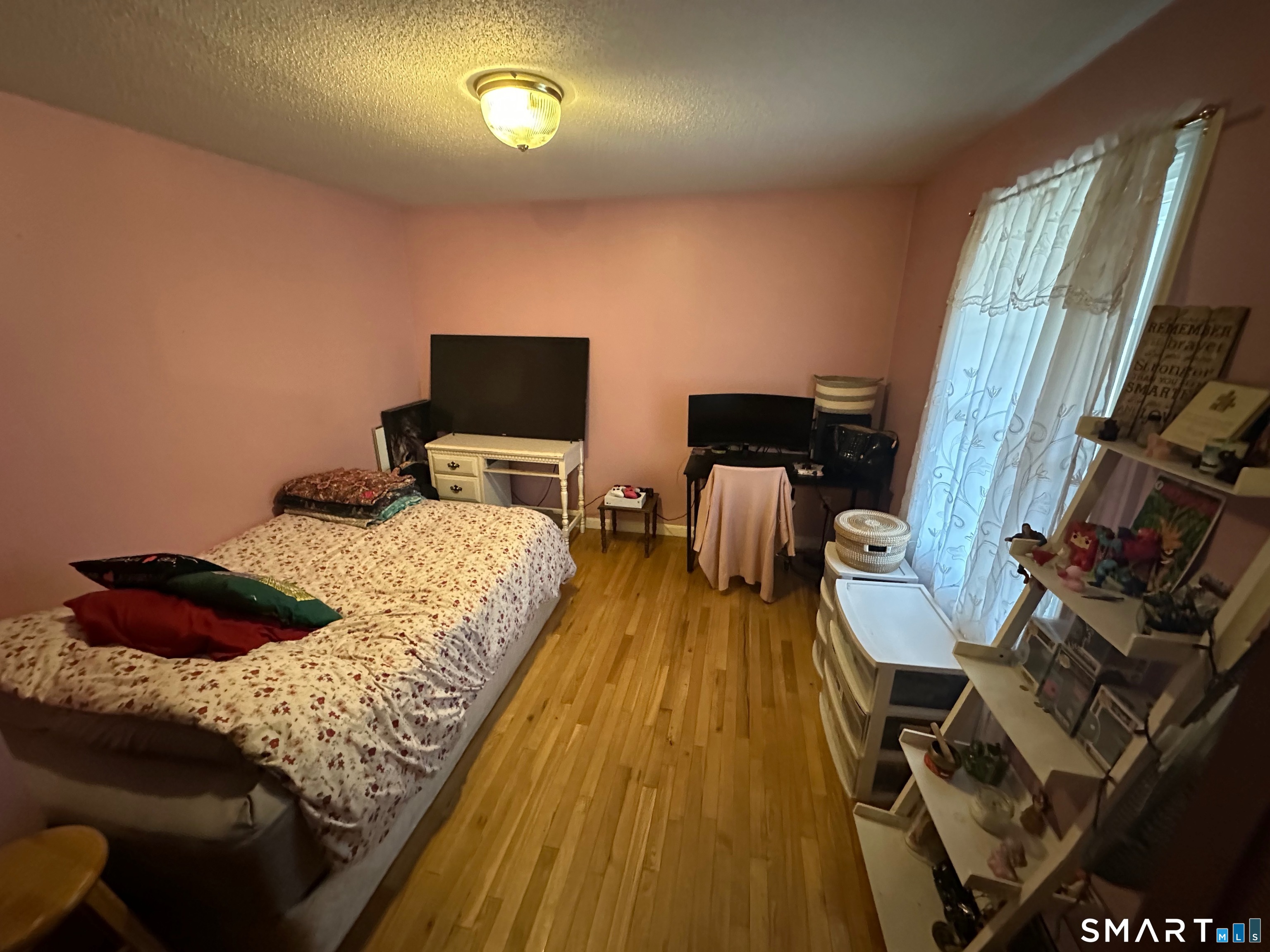 120 Tyler Way Bristol, CT 06010 - Photo 14 of 40 a bedroom with bed and wooden floor