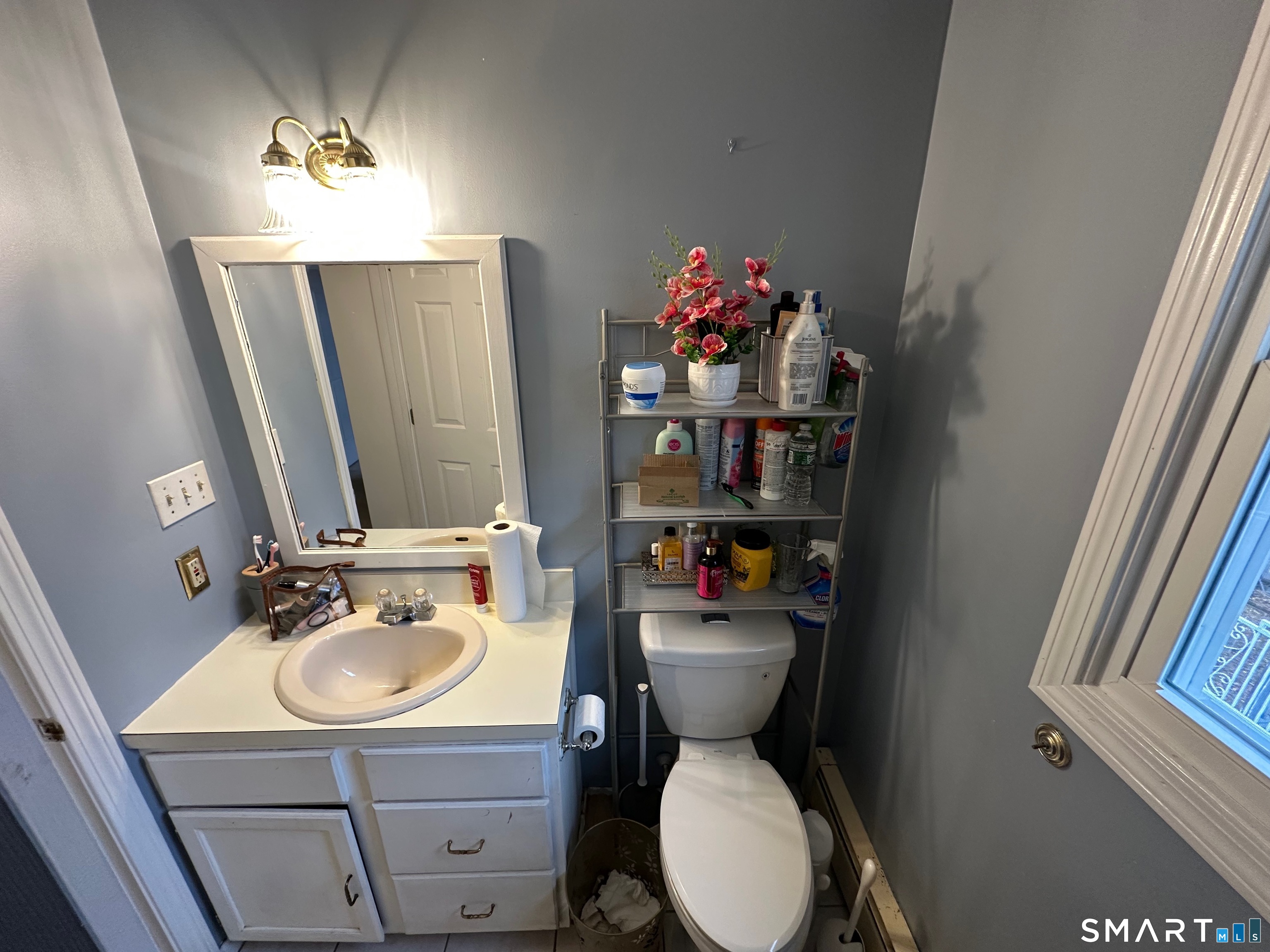 120 Tyler Way Bristol, CT 06010 - Photo 22 of 40 a bathroom with a sink toilet and a mirror