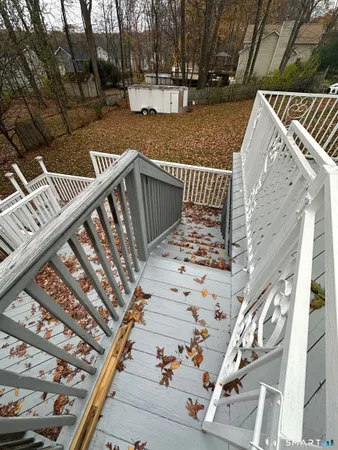 a balcony with wooden floor