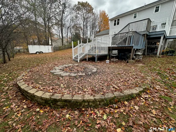 a view of a house with a yard and sitting area