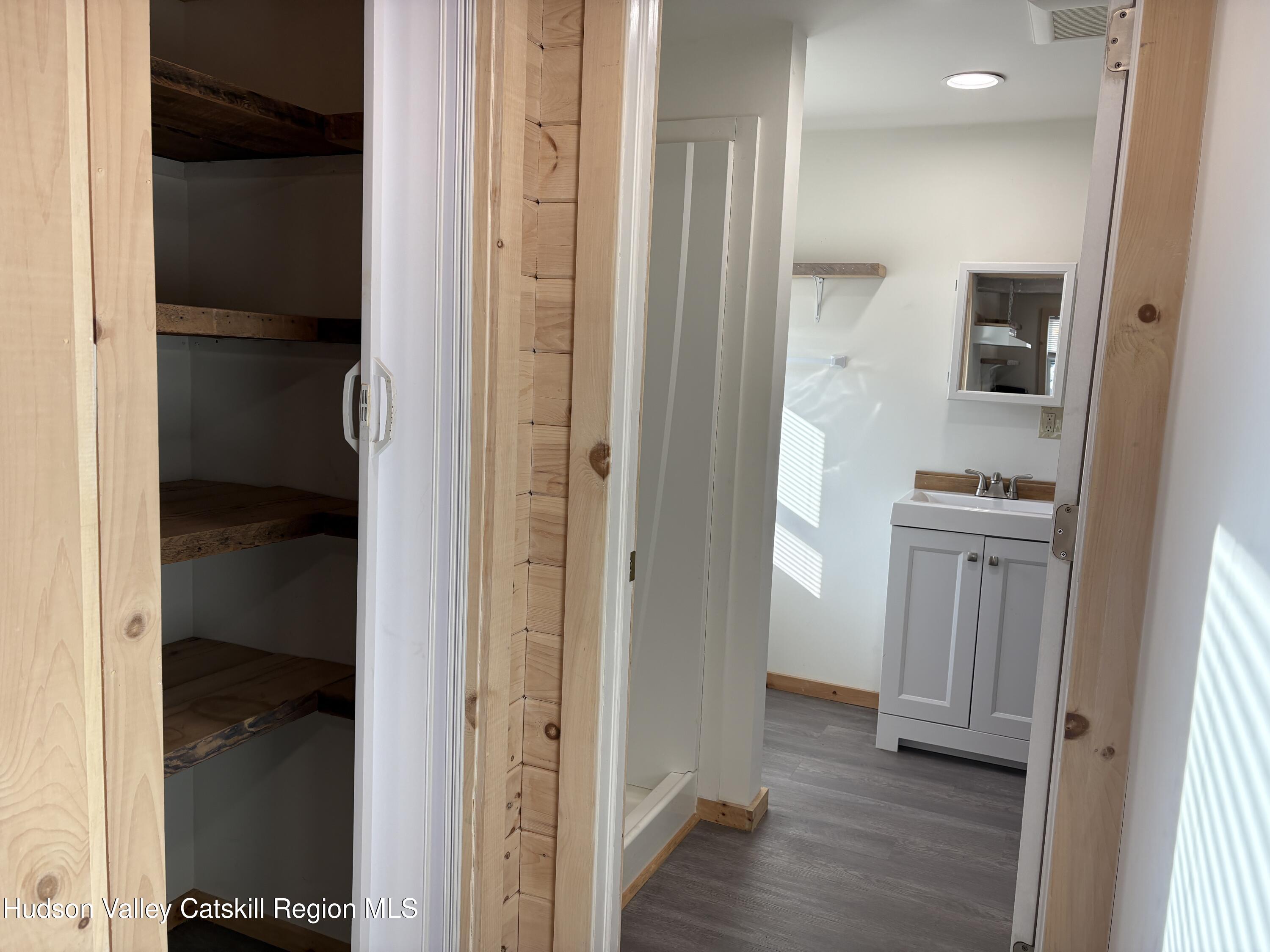 18 Market Street, Unit 2 Saugerties, NY 12477 - Photo 6 of 8 a view of hallway with wooden floor