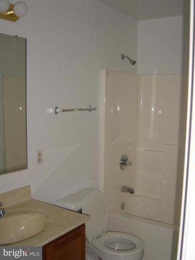 9463 Shiloh Church Road Rixeyville, VA 22737 - Photo 3 of 7 a bathroom with a granite countertop sink toilet and shower