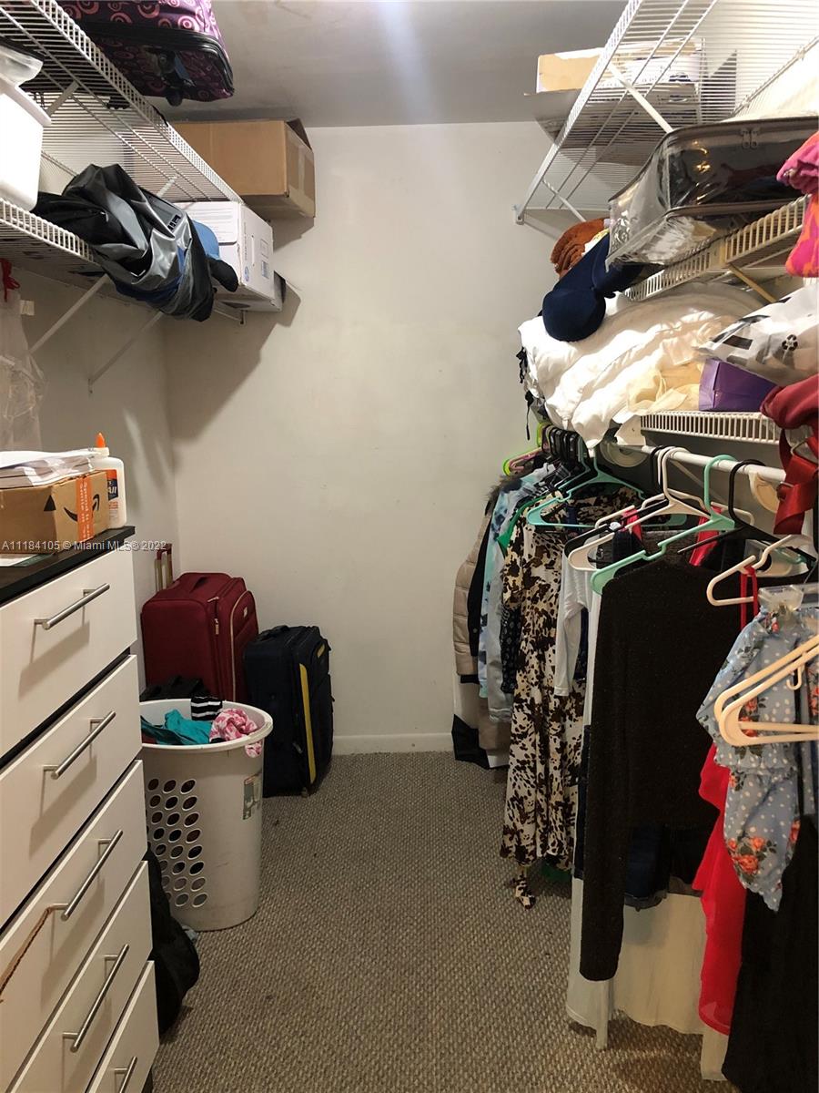 Kendall Miami, FL 33173 - Photo 15 of 26 a view of walk in closet with clothes and shoes