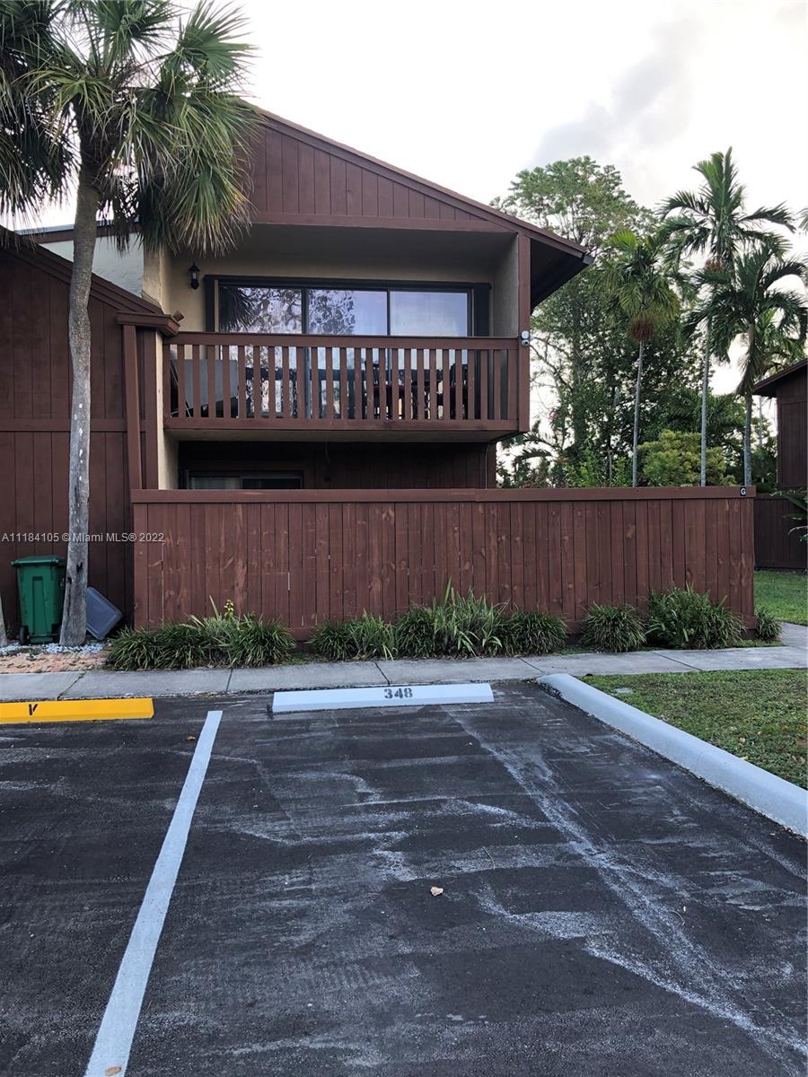 Kendall Miami, FL 33173 - Photo 2 of 26 a wooden bench sitting in front of a building