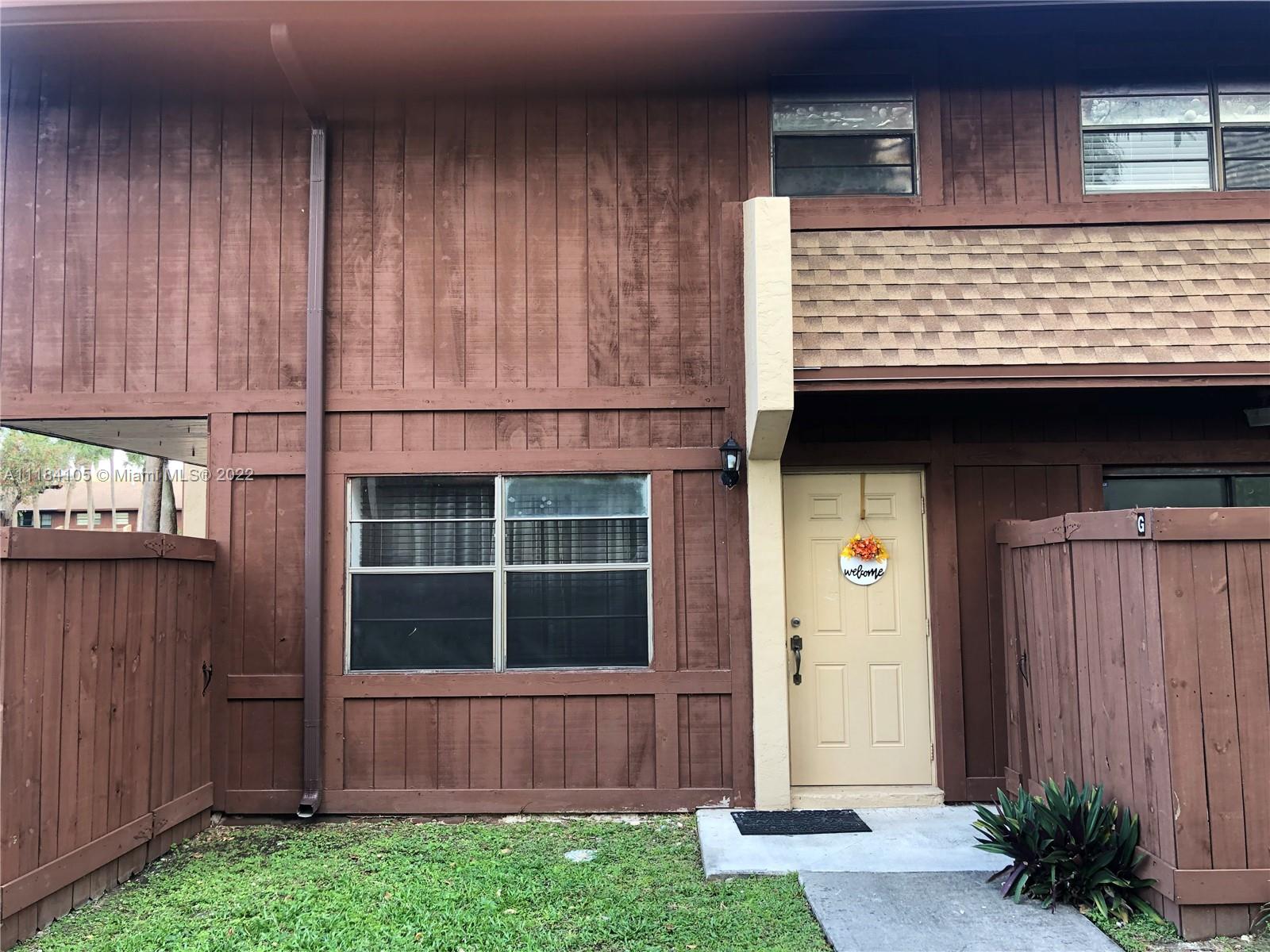 Kendall Miami, FL 33173 - Photo 25 of 26 a view of a house with a small yard and wooden fence