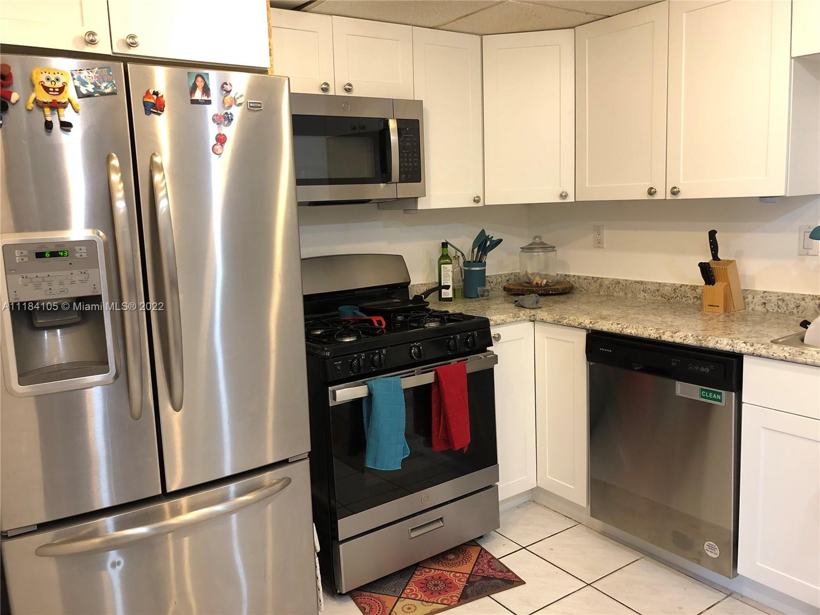 Kendall Miami, FL 33173 - Photo 3 of 26 a kitchen with stainless steel appliances granite countertop a refrigerator a stove and a sink