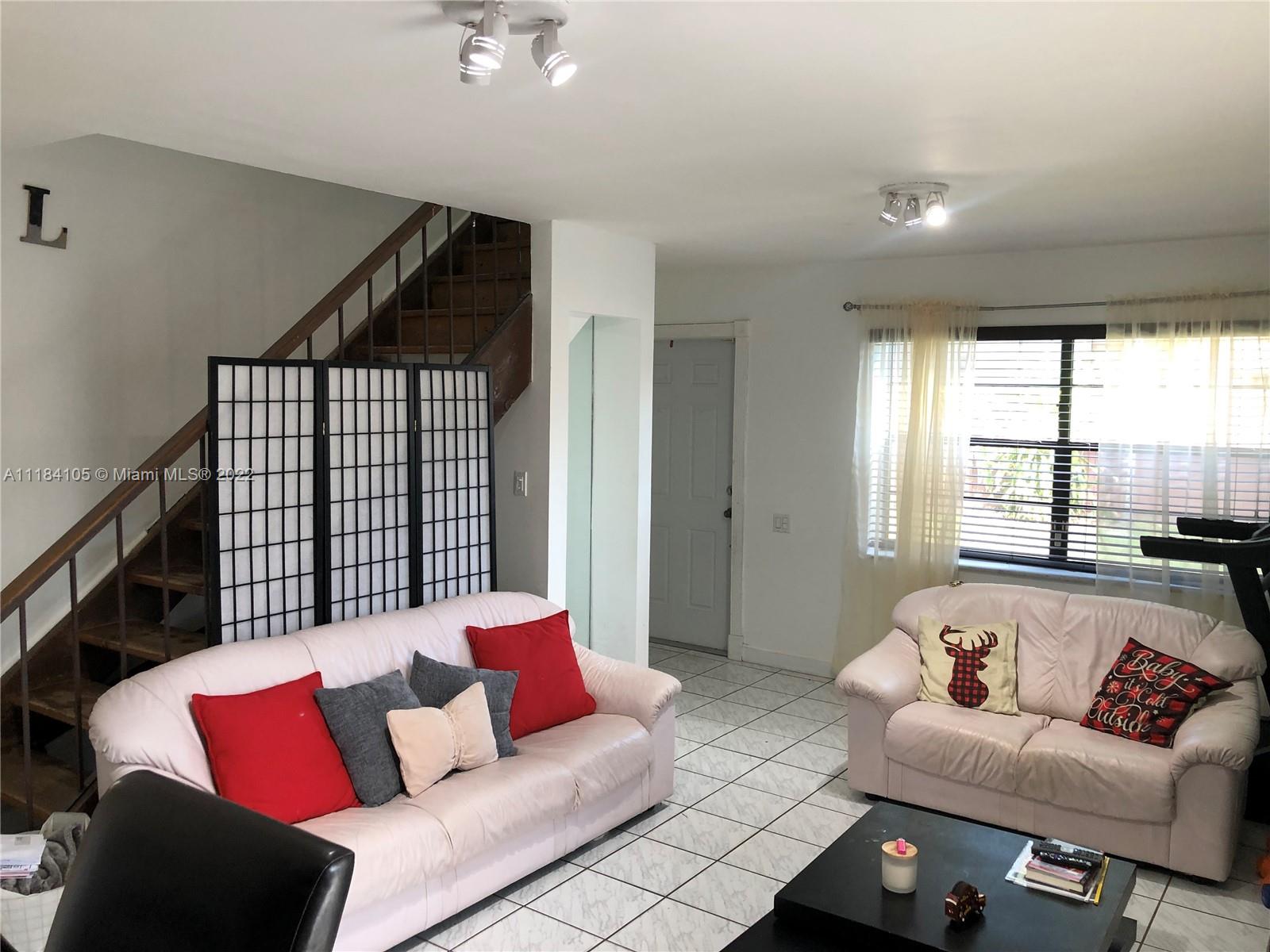 Kendall Miami, FL 33173 - Photo 5 of 26 a living room with furniture and a window