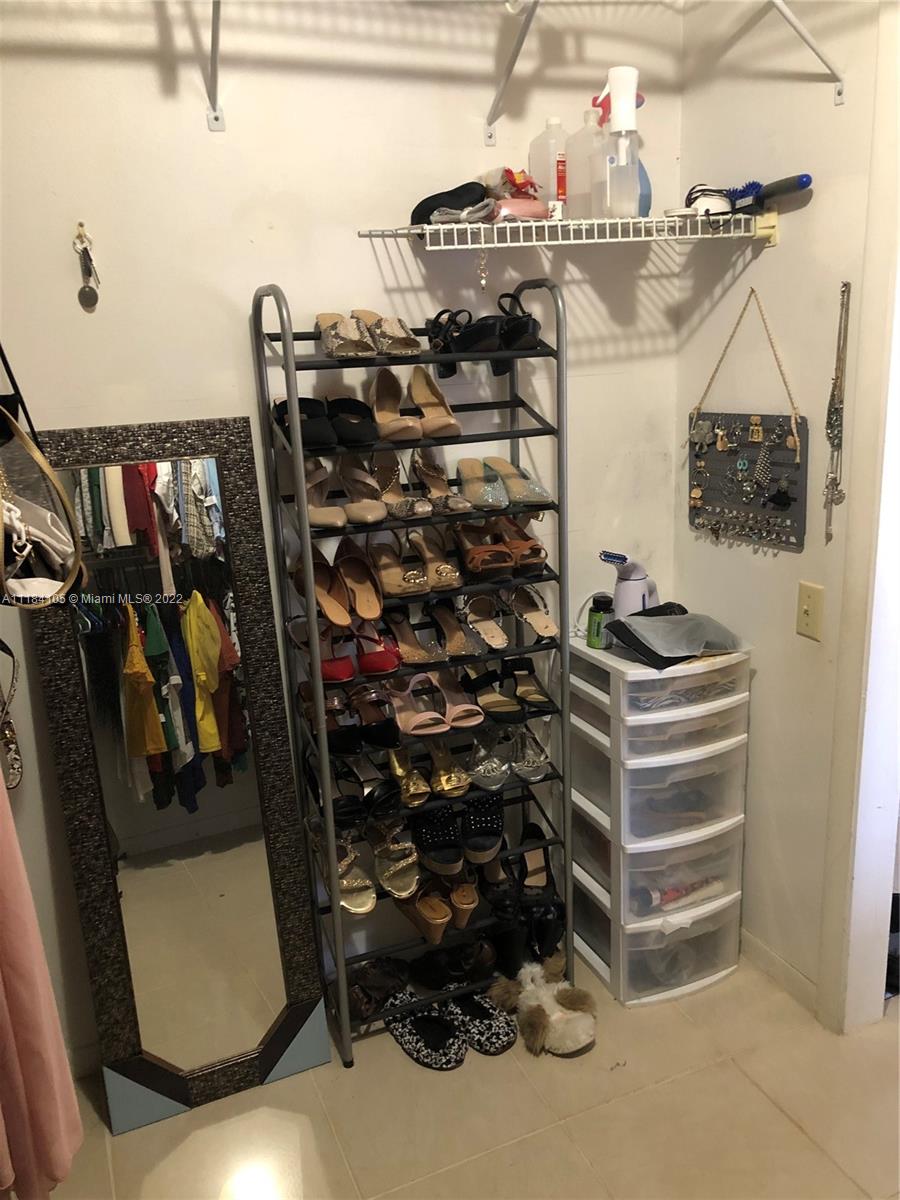 Kendall Miami, FL 33173 - Photo 10 of 26 a view of walk in closet with clothes and shoes