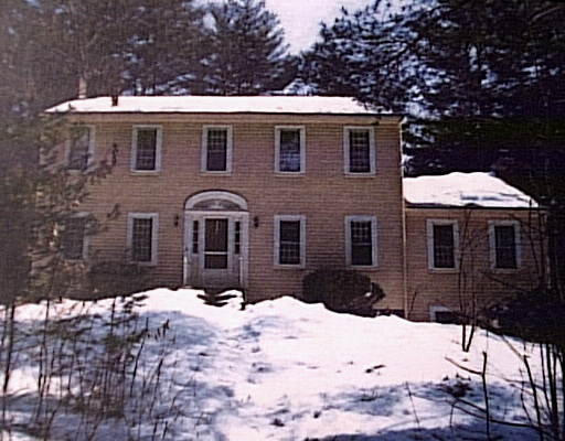 24 Juniper Road Sudbury, MA 01776 - Photo 1 of 1 a front view of a house with a yard covered in snow