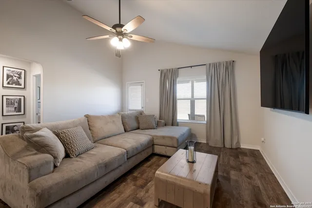 a living room with furniture and a large window