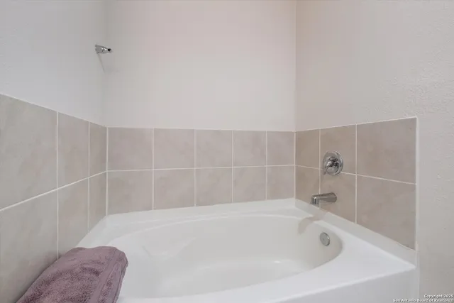 a bathroom with a bathtub