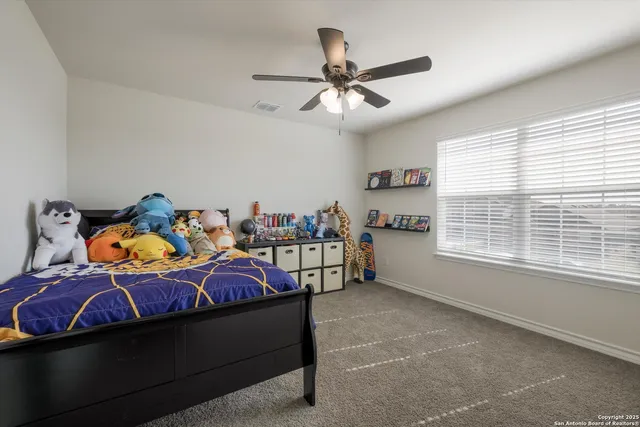 a bedroom with furniture and a window