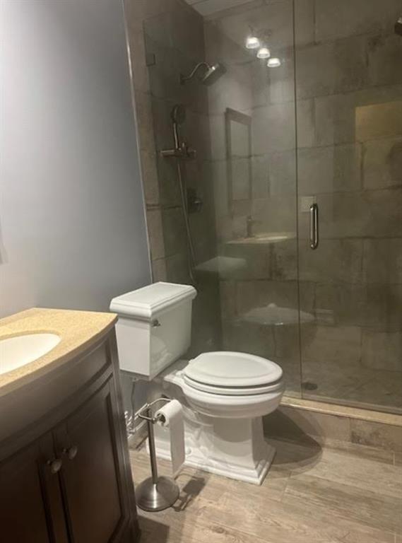 15109 Jackson Road Delray Beach, FL 33484 - Photo 6 of 14 a white toilet sitting next to a bathroom sink and vanity