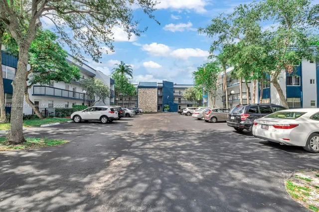 a view of street with parked cars
