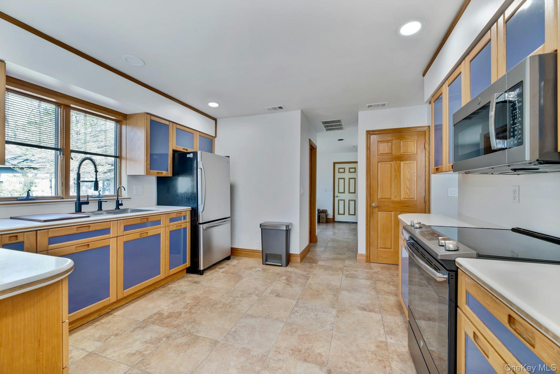2905 Private Road East Marion, NY 11939 - Photo 11 of 33 Kitchen featuring visible vents, recessed lighting, appliances with stainless steel finishes, and light countertops