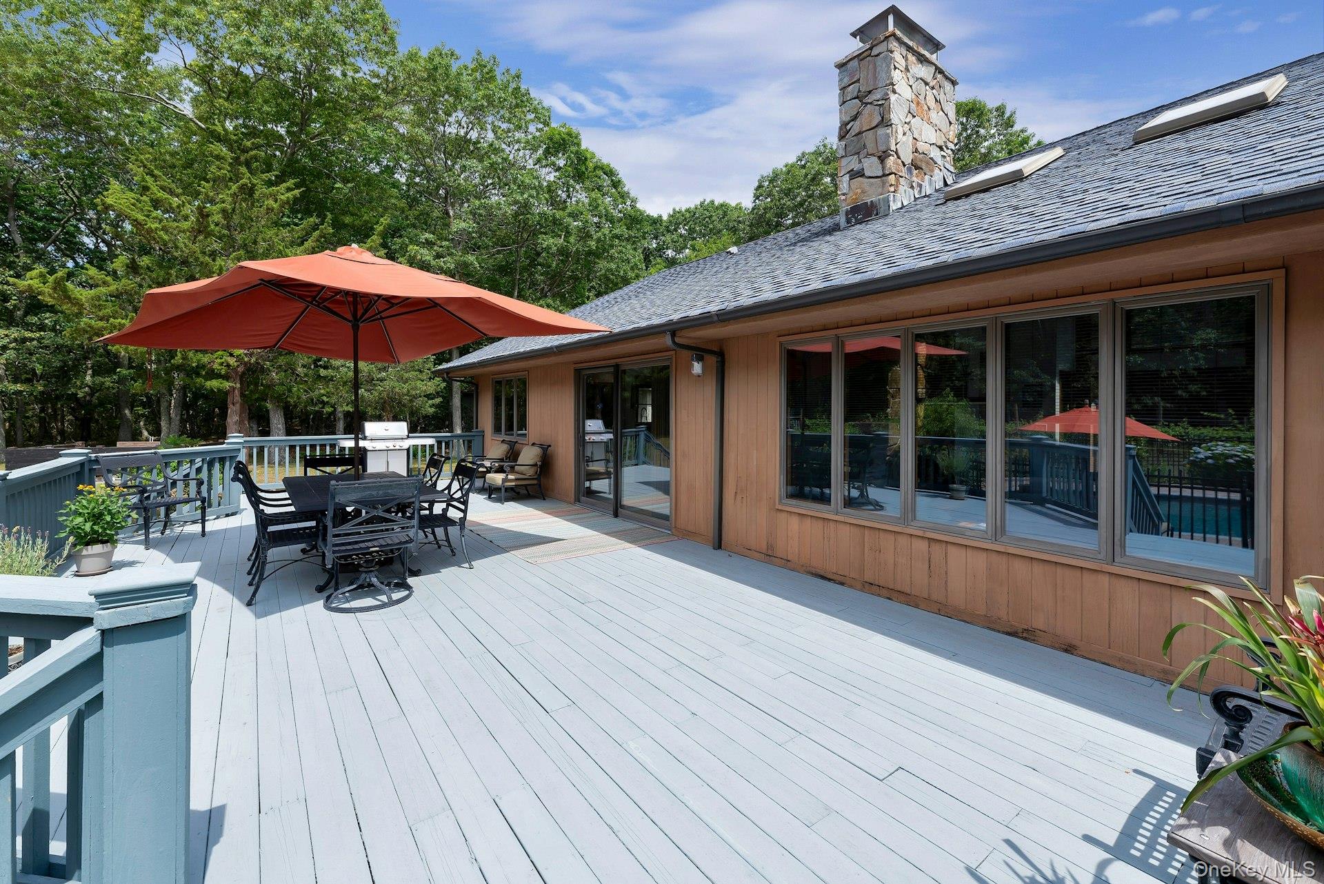 2905 Private Road East Marion, NY 11939 - Photo 2 of 33 Wooden deck with outdoor dining area