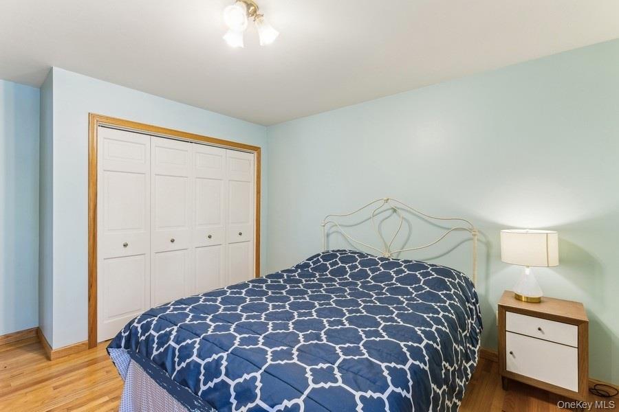 2905 Private Road East Marion, NY 11939 - Photo 22 of 33 Bedroom with hardwood / wood-style floors and a closet