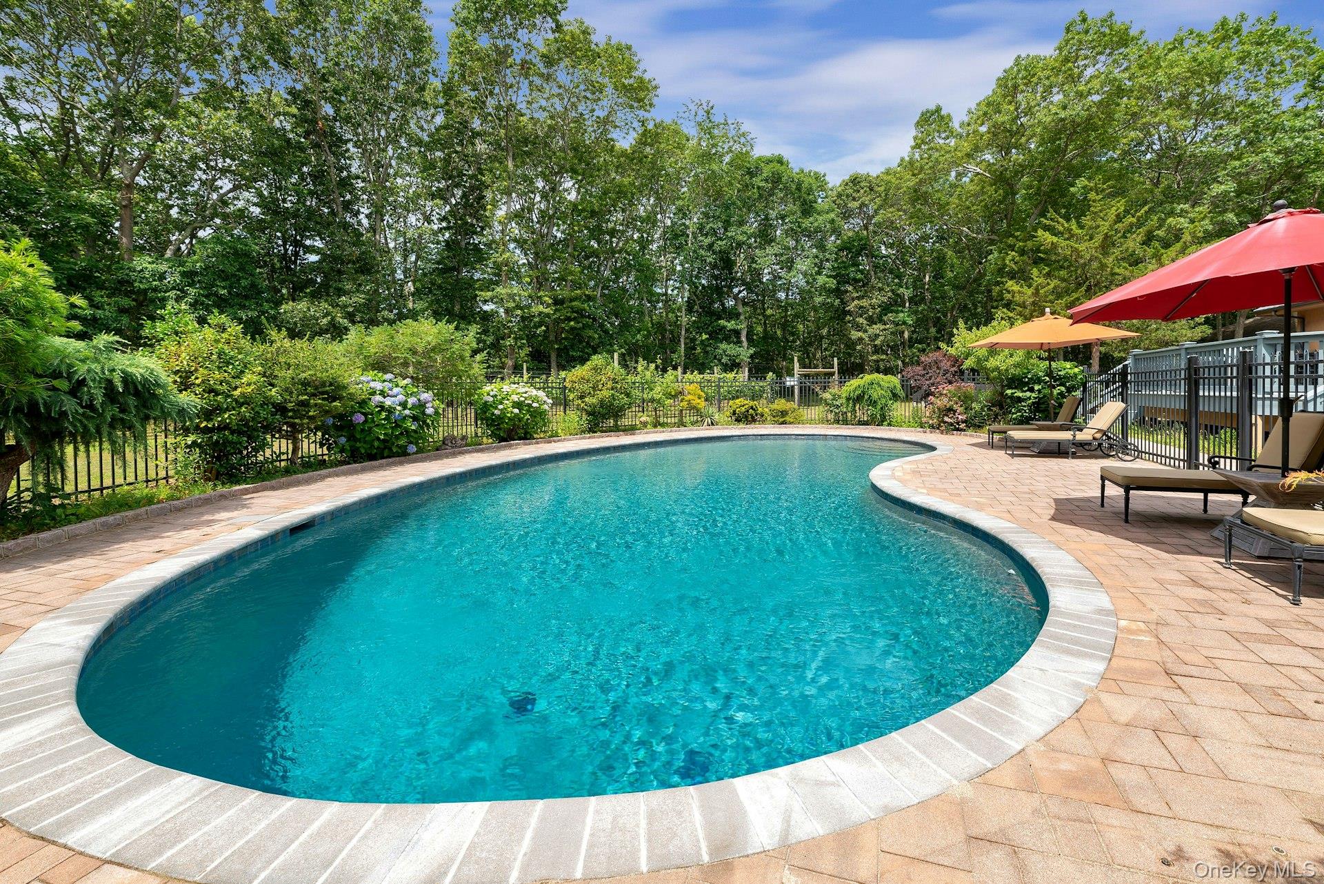 2905 Private Road East Marion, NY 11939 - Photo 33 of 33 View of pool featuring a patio and view of scattered trees