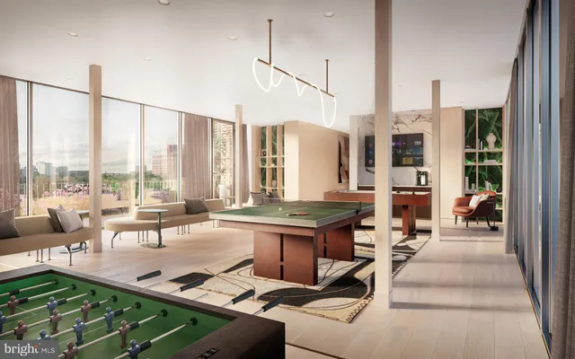 a living room with patio furniture and a floor to ceiling window