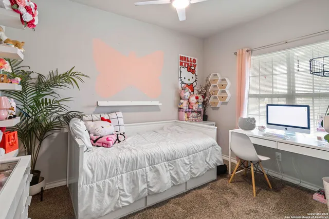 a bedroom with a bed and a table