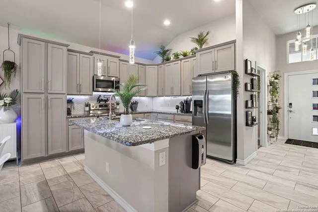 a kitchen with refrigerator cabinets and a counter top space