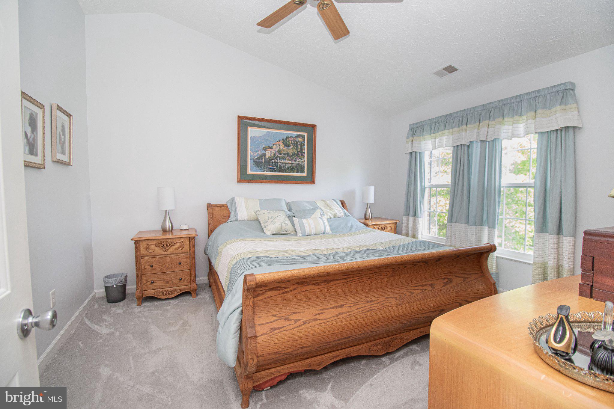1724 Algonquin Road Frederick, MD 21701 - Photo 27 of 55 a bedroom with a bed and a couch