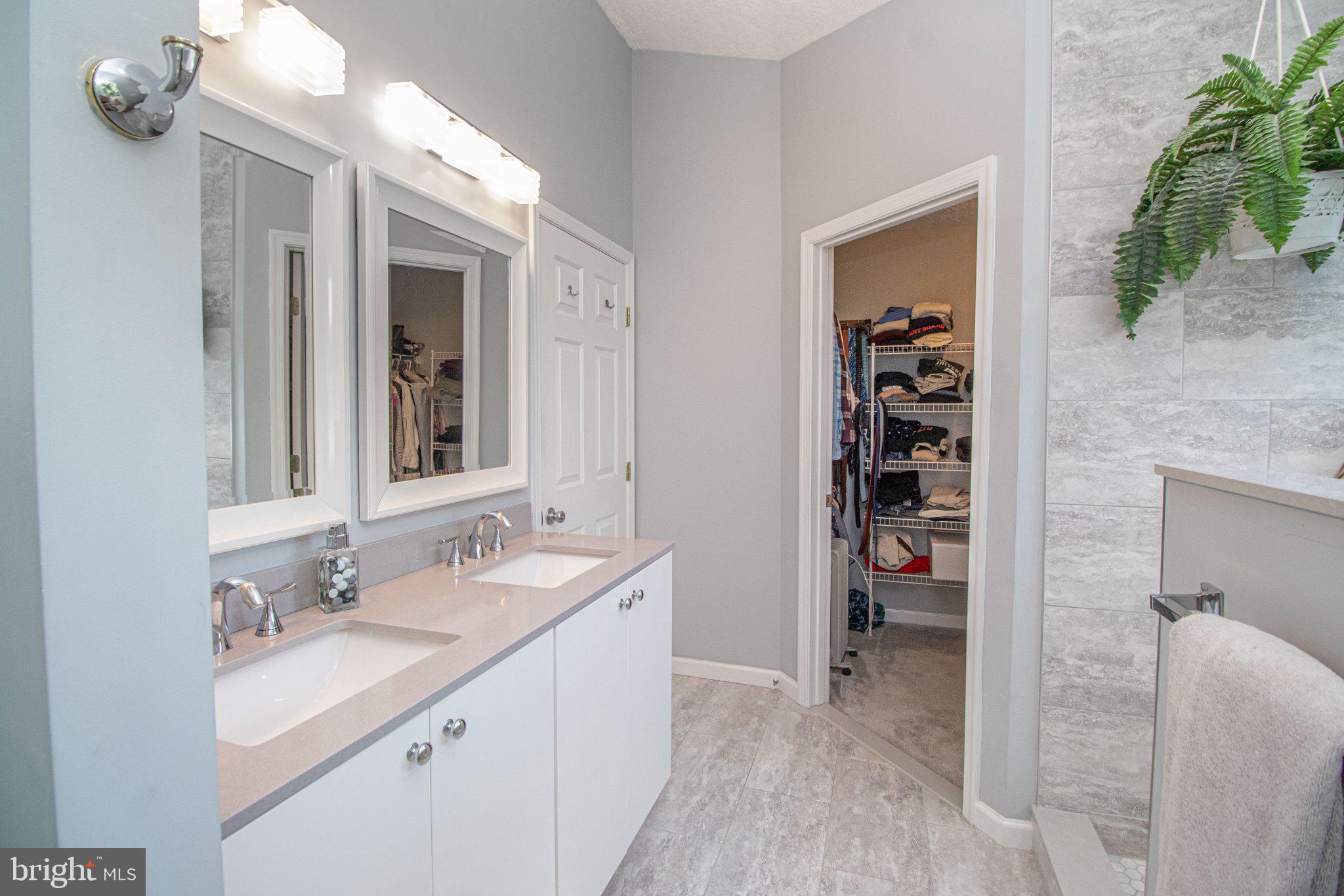 1724 Algonquin Road Frederick, MD 21701 - Photo 34 of 55 a bathroom with a sink a vanity and a mirror
