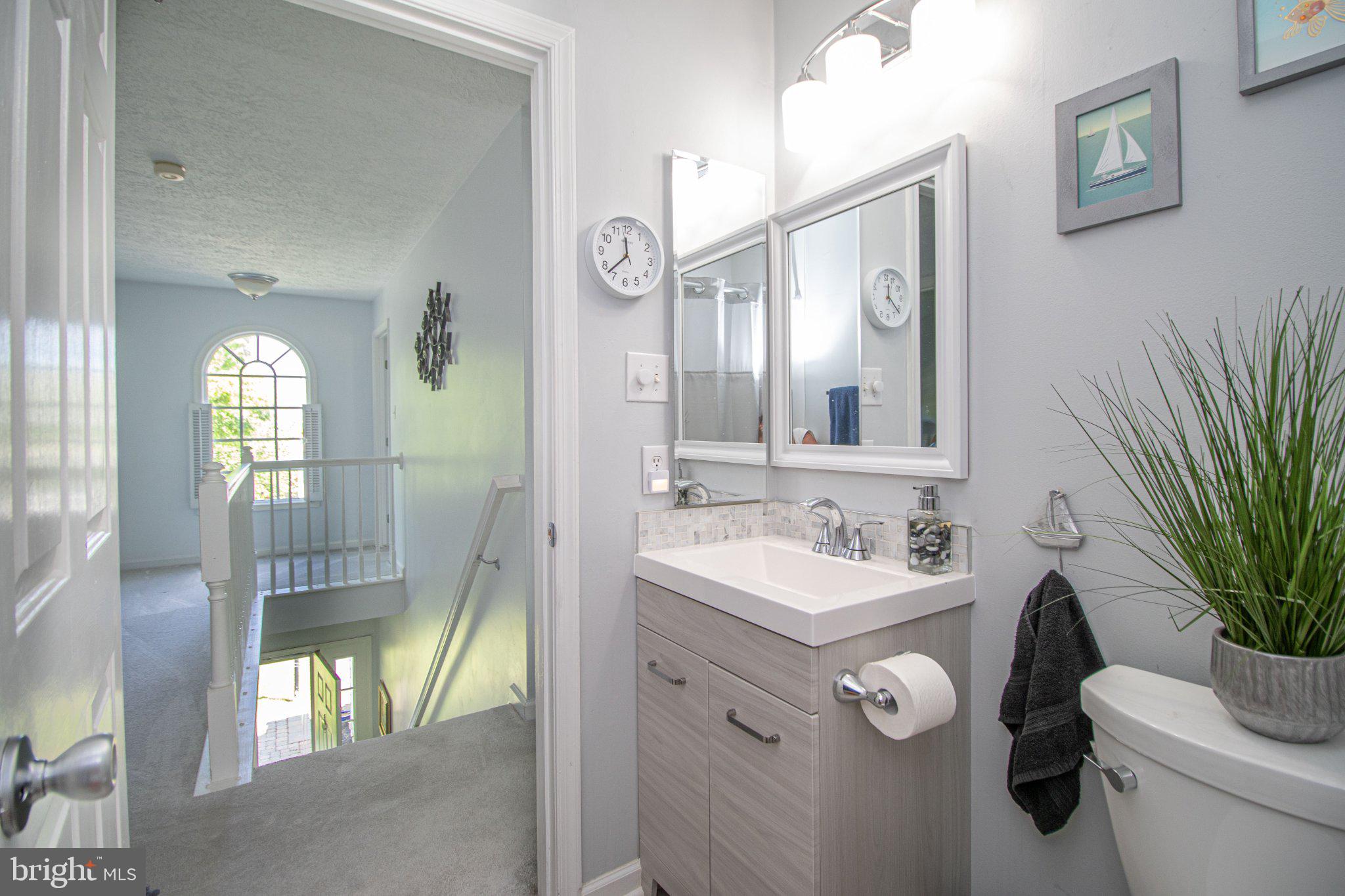 1724 Algonquin Road Frederick, MD 21701 - Photo 38 of 55 a bathroom with a sink vanity granite and toilet