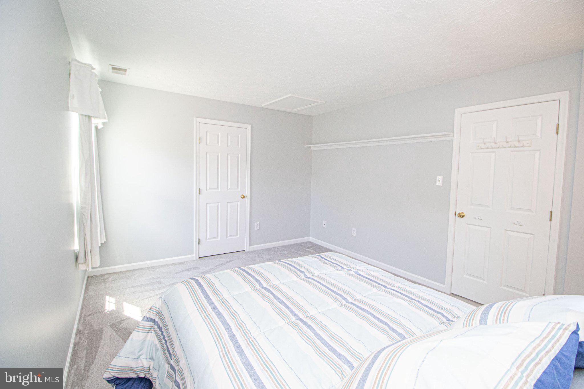 1724 Algonquin Road Frederick, MD 21701 - Photo 41 of 55 a bedroom with a bed and a cabinets