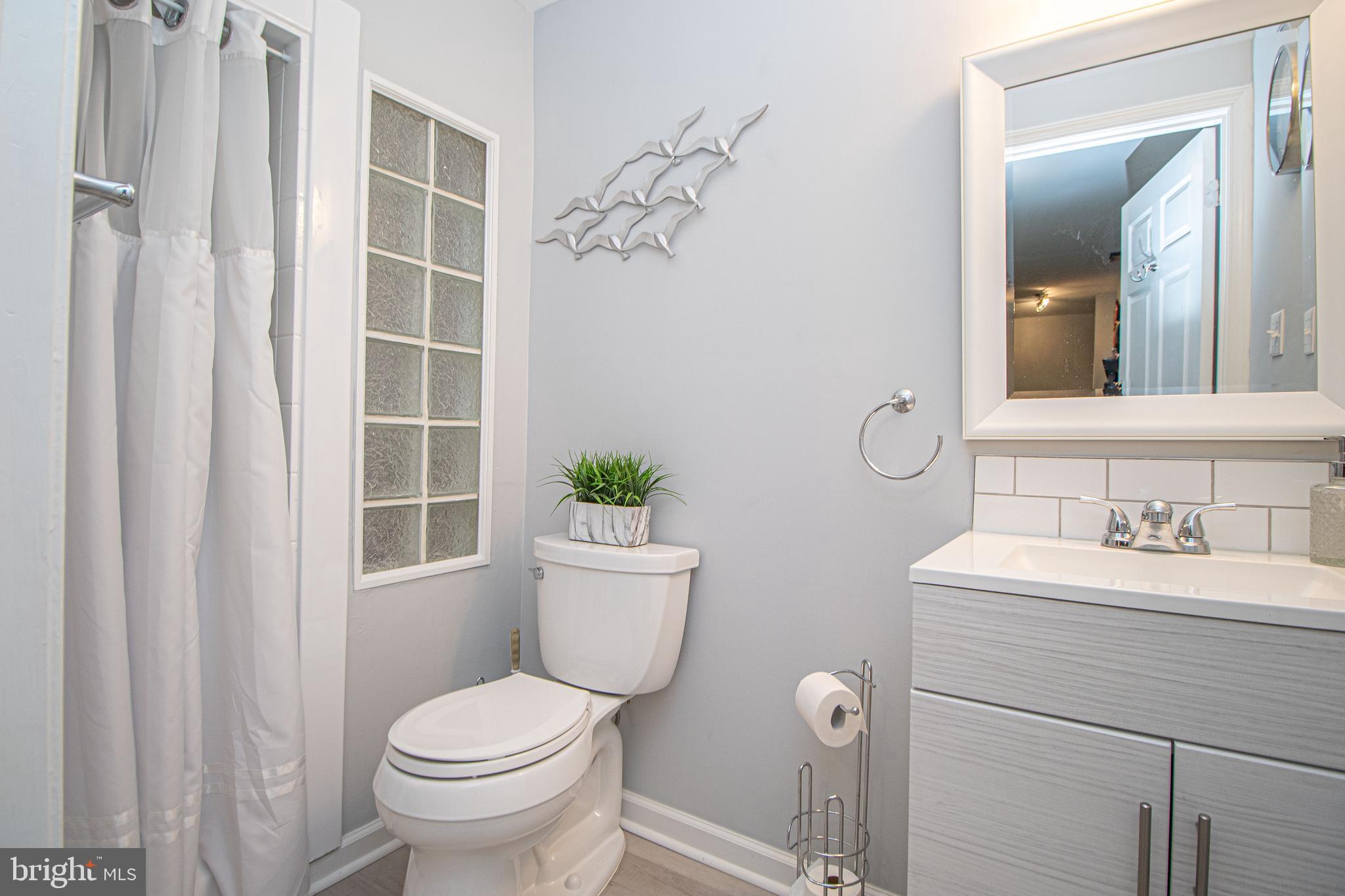 1724 Algonquin Road Frederick, MD 21701 - Photo 45 of 55 a bathroom with a toilet sink and shower