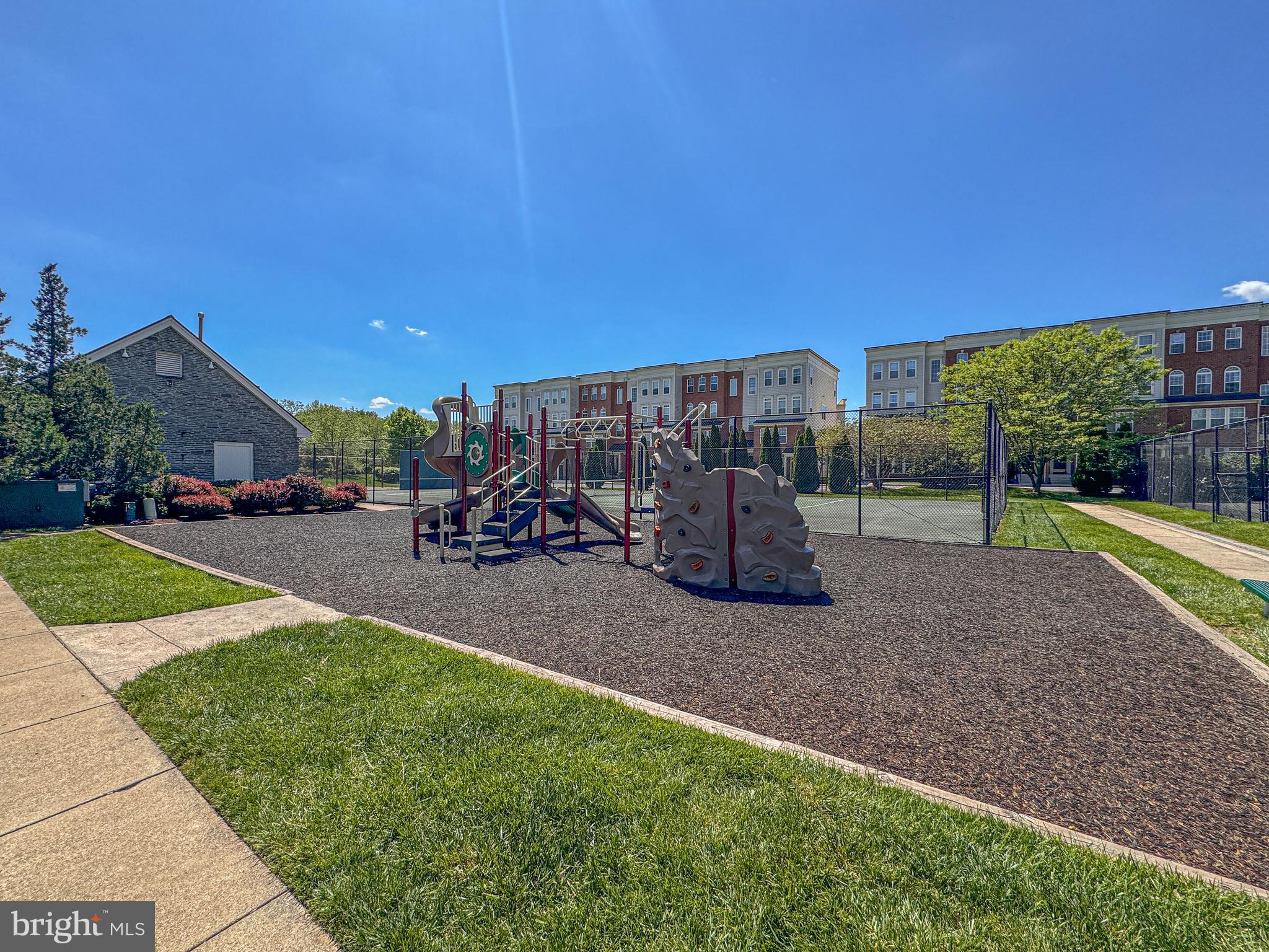 1724 Algonquin Road Frederick, MD 21701 - Photo 48 of 55 a view of a park with swings and slides