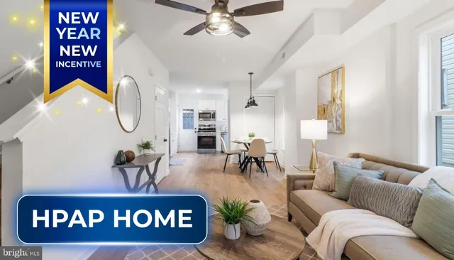 a living room with furniture a dining table and chairs