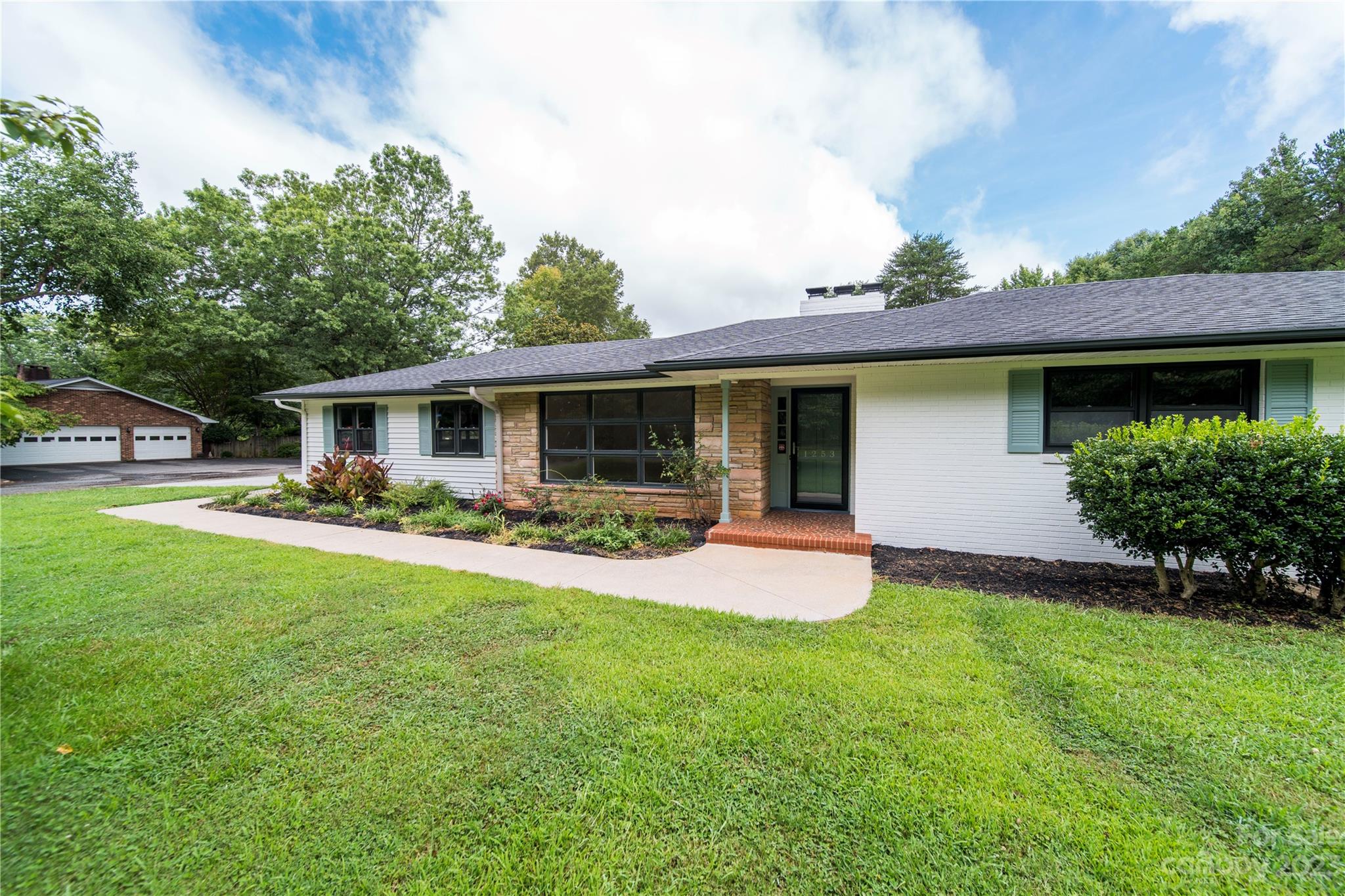 1253 Rainbow Road Advance, NC 27006 - Photo 11 of 46 a front view of house with yard and outdoor seating