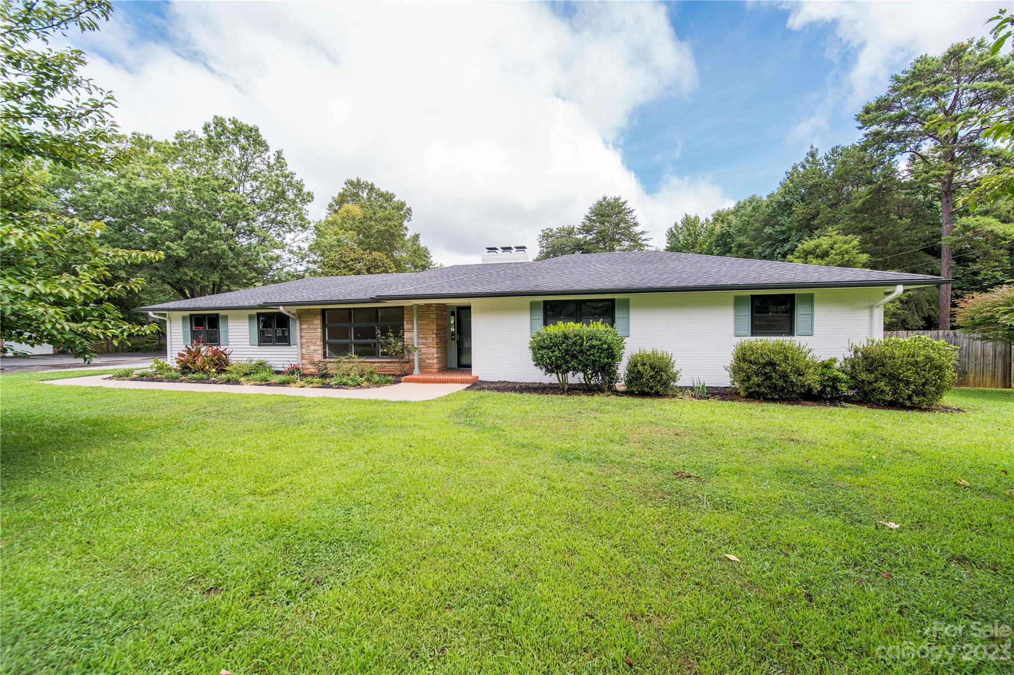 1253 Rainbow Road Advance, NC 27006 - Photo 12 of 46 a front view of house with a garden and porch