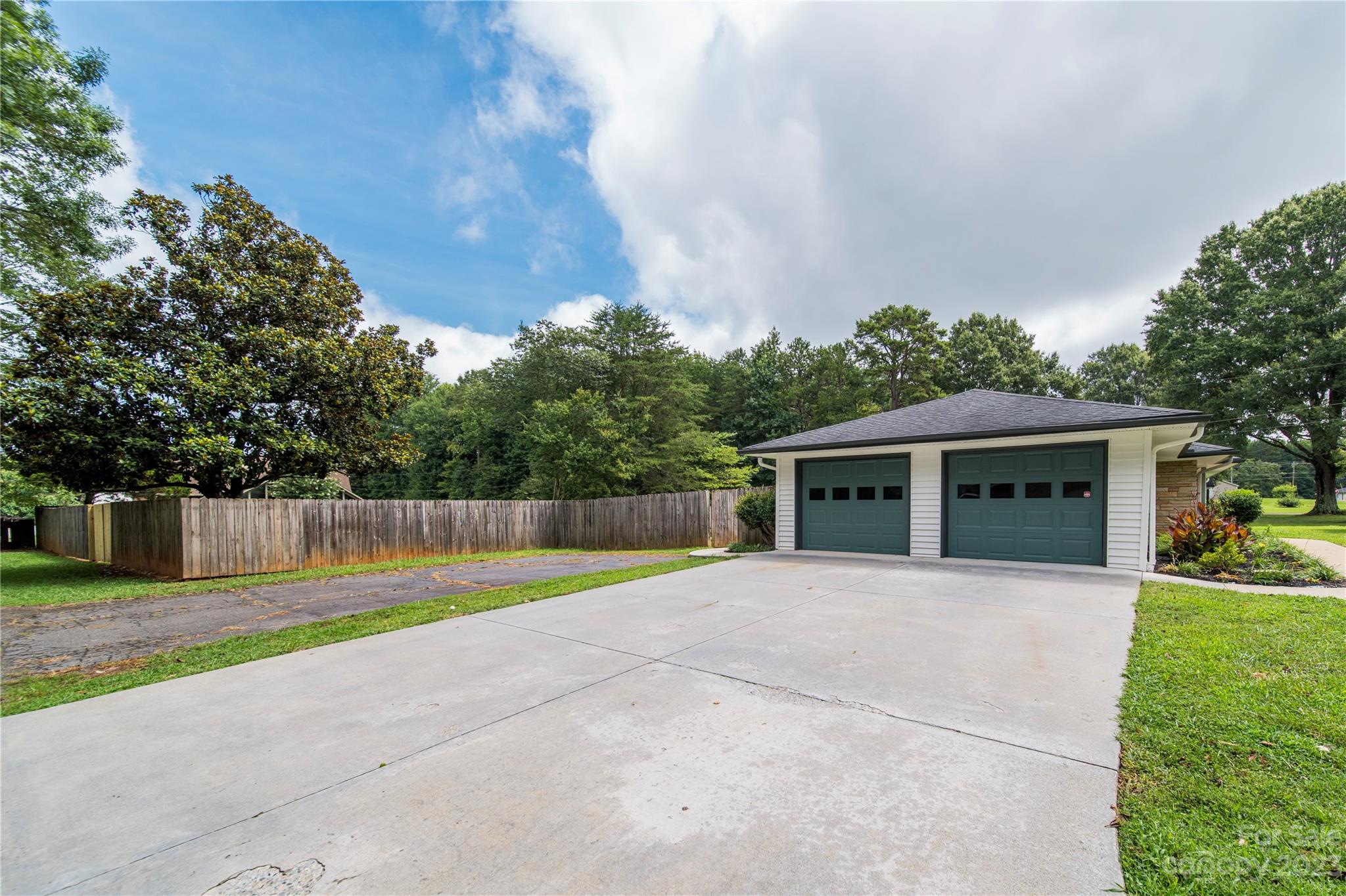 1253 Rainbow Road Advance, NC 27006 - Photo 13 of 46 a house with trees in the background