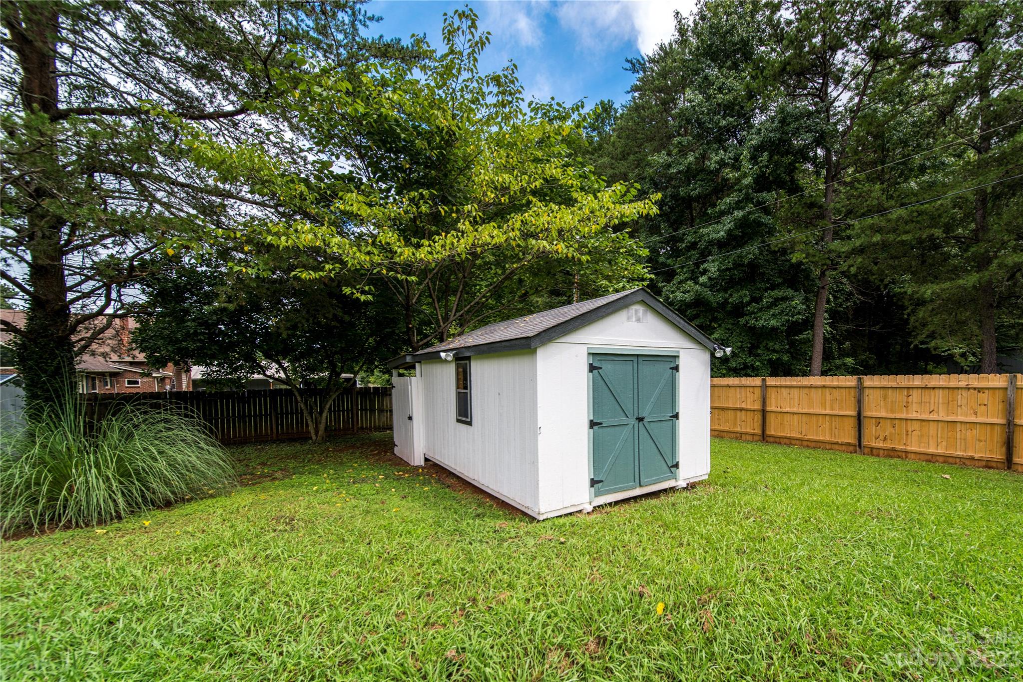 1253 Rainbow Road Advance, NC 27006 - Photo 16 of 46 a view of a backyard with a garden