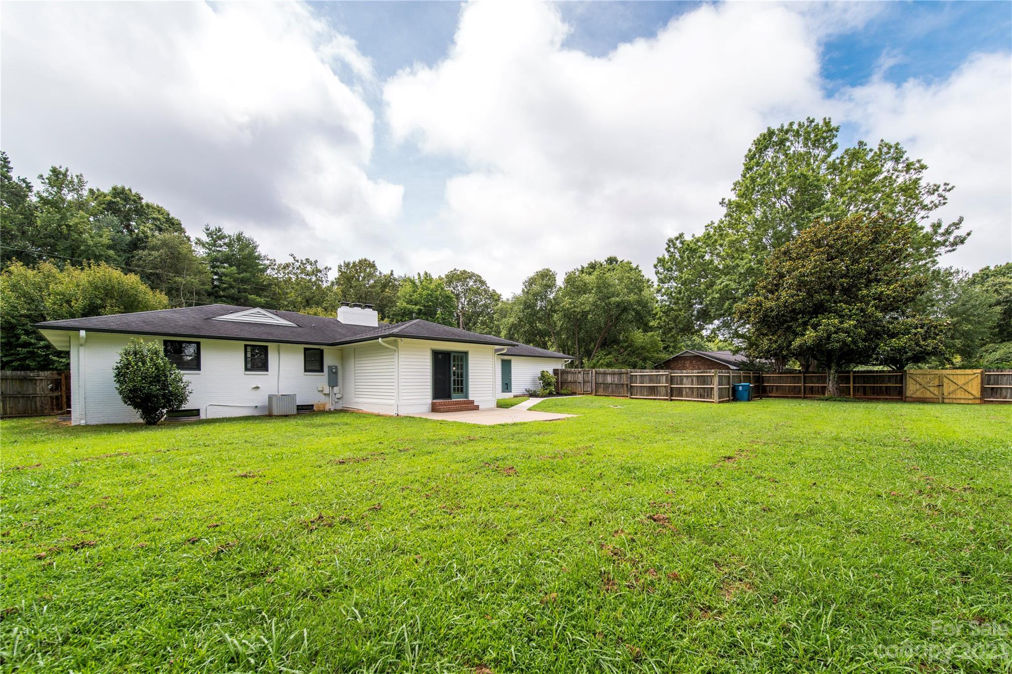 1253 Rainbow Road Advance, NC 27006 - Photo 17 of 46 a house view with a garden space