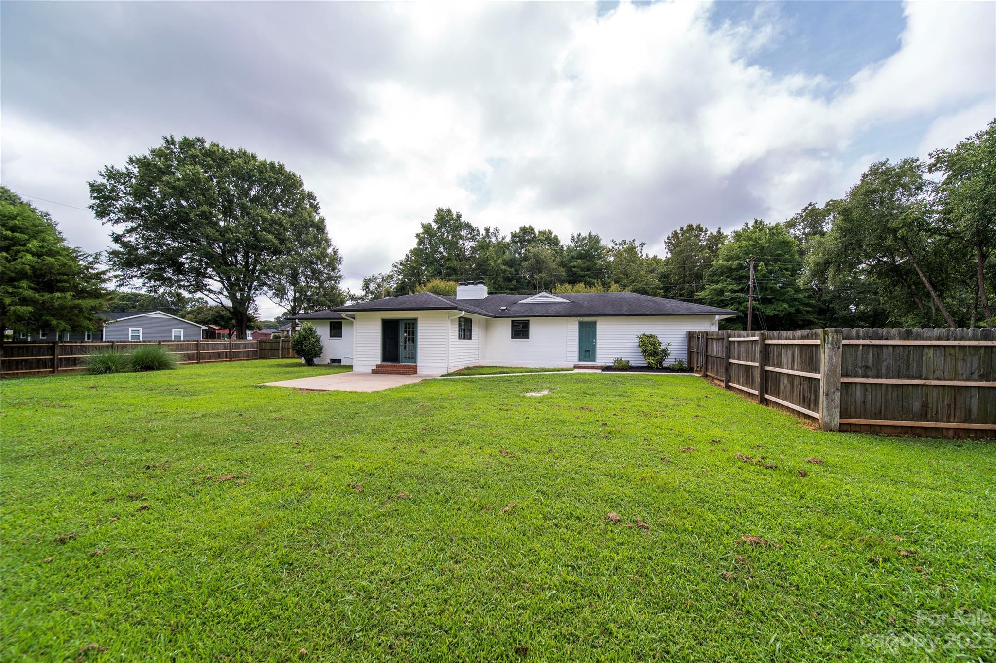 1253 Rainbow Road Advance, NC 27006 - Photo 20 of 46 a view of a house with a backyard