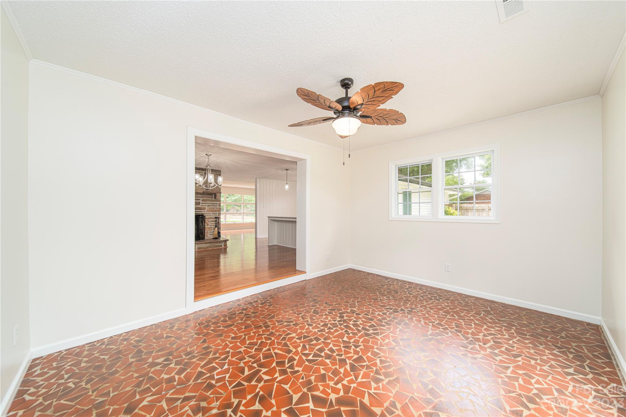 1253 Rainbow Road Advance, NC 27006 - Photo 28 of 46 a view of a big room with wooden floor and a chandelier fan