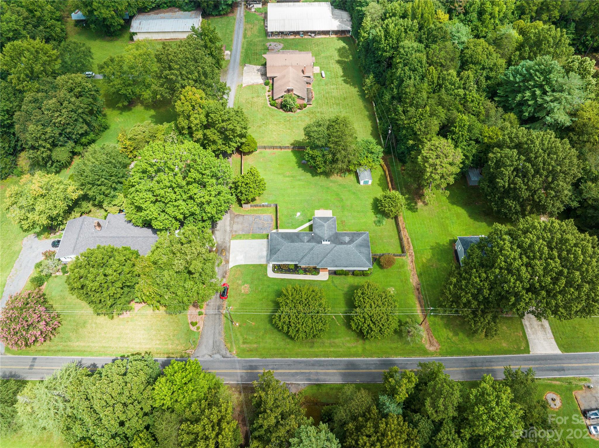 1253 Rainbow Road Advance, NC 27006 - Photo 4 of 46 an aerial view of residential house with outdoor space and trees all around