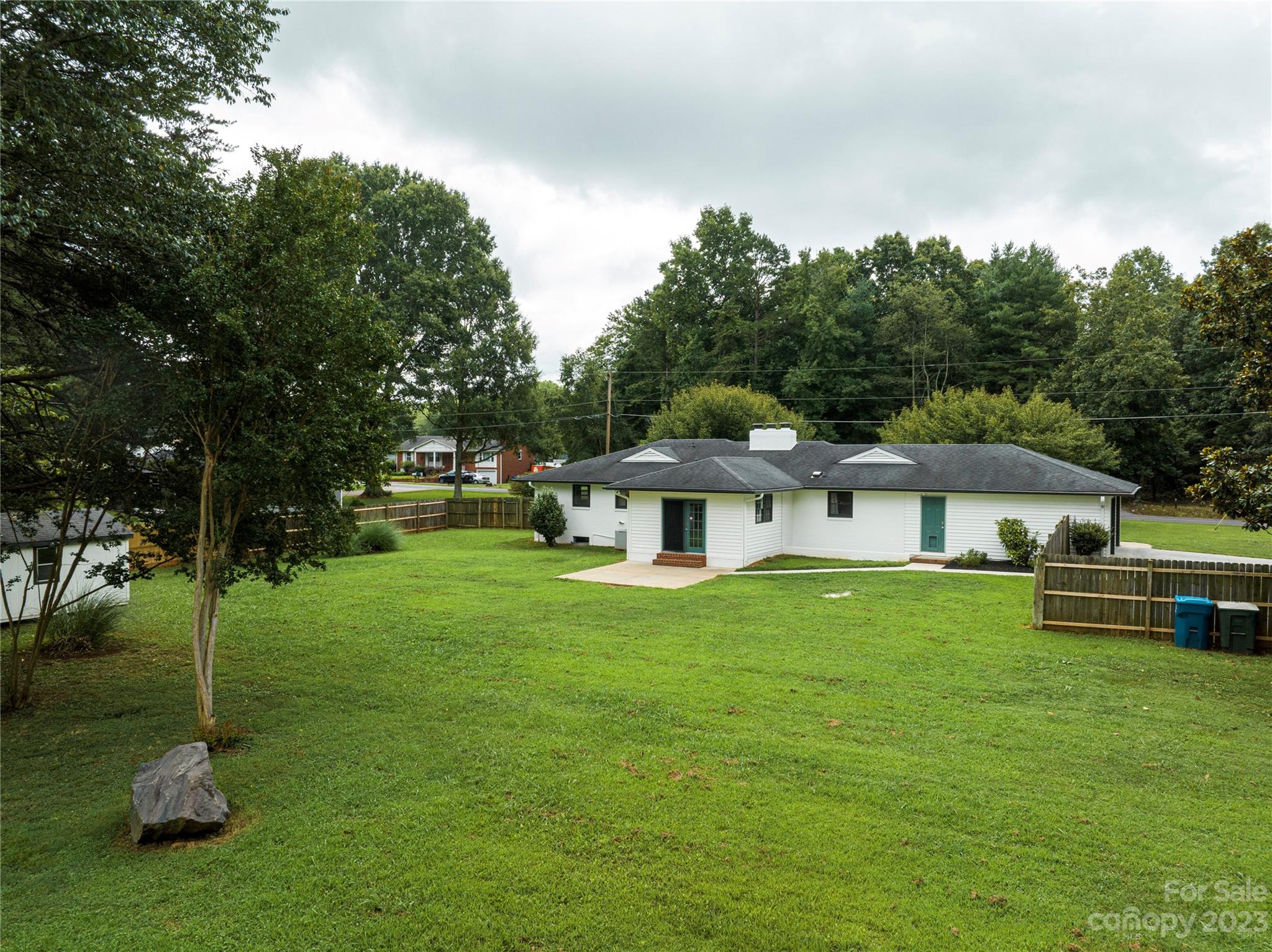 1253 Rainbow Road Advance, NC 27006 - Photo 7 of 46 a front view of a house with a garden
