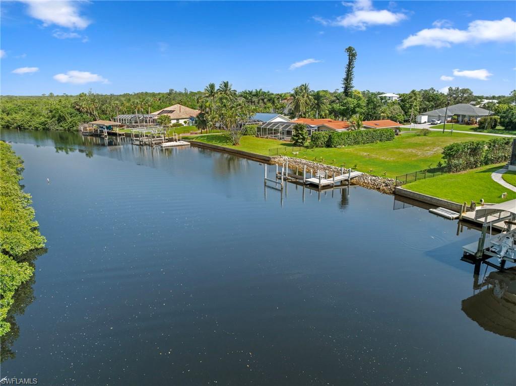 4947 Riverside Drive Estero, FL 33928 - Photo 11 of 16 a view of a lake with a city