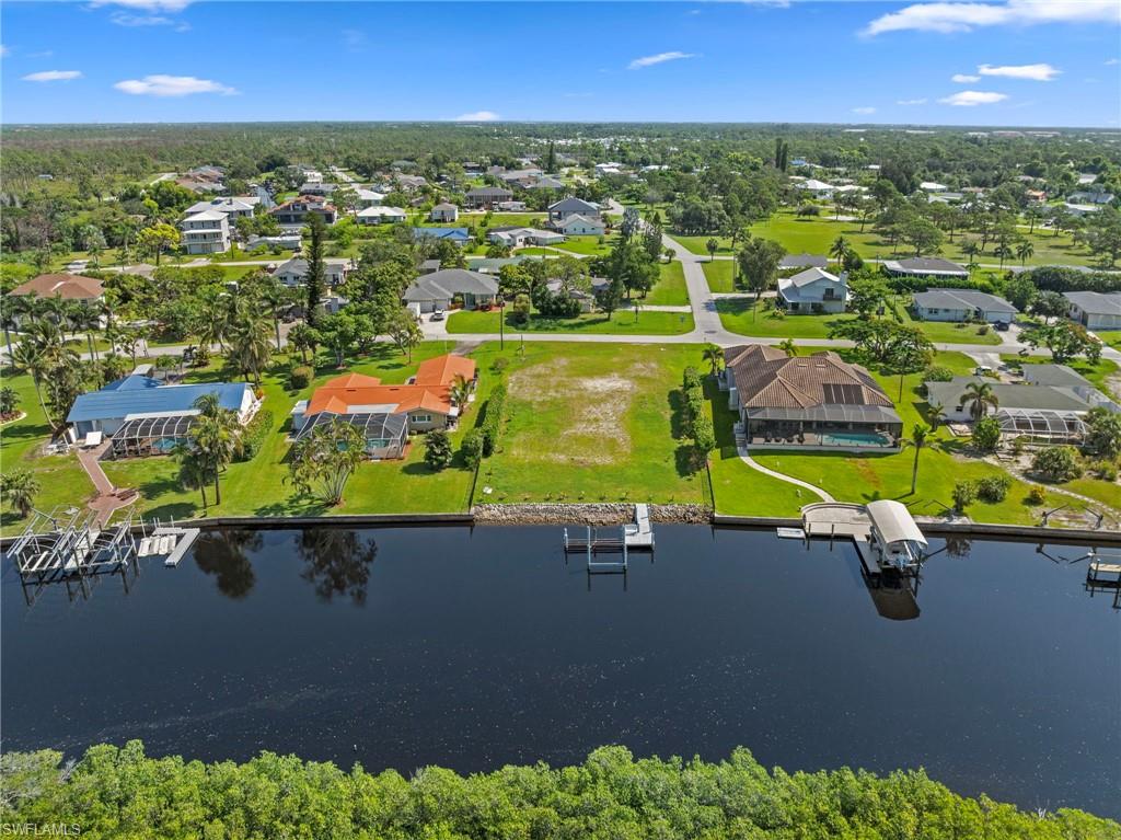 4947 Riverside Drive Estero, FL 33928 - Photo 12 of 16 an aerial view of residential houses with outdoor space and swimming pool