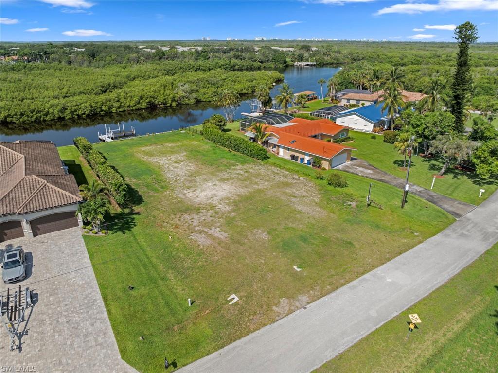 4947 Riverside Drive Estero, FL 33928 - Photo 3 of 16 a view of a lake with a yard