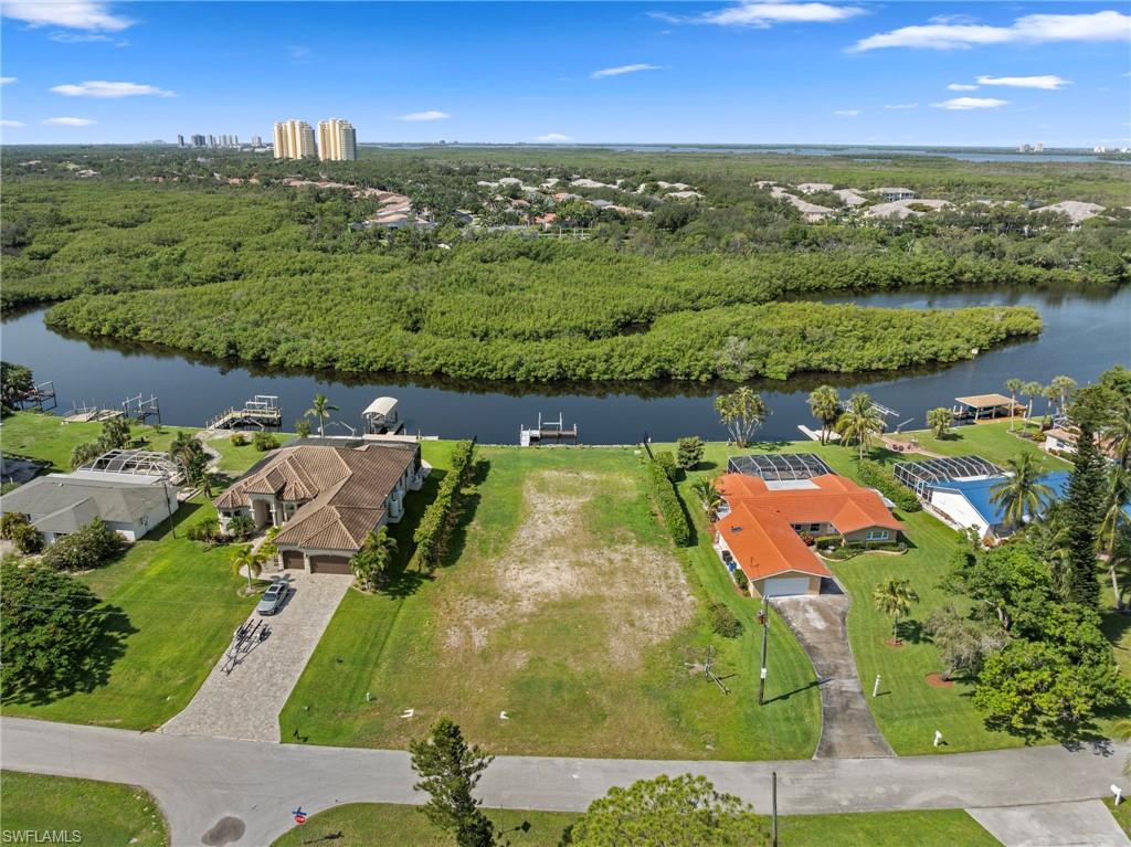 4947 Riverside Drive Estero, FL 33928 - Photo 4 of 16 an aerial view of a houses with a lake view