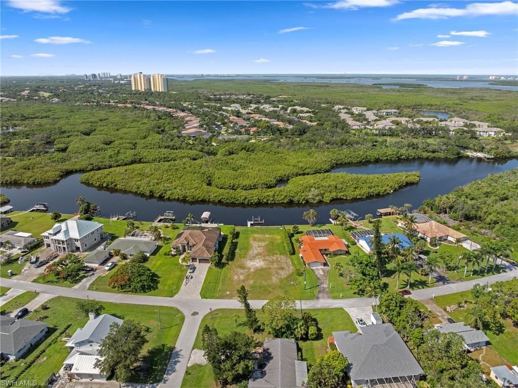 4947 Riverside Drive Estero, FL 33928 - Photo 5 of 16 an aerial view of ocean and residential houses with outdoor space