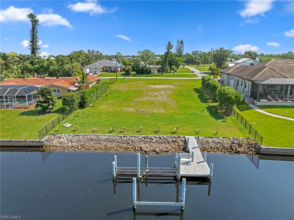 4947 Riverside Drive Estero, FL 33928 - Photo 10 of 16 a view of a swimming pool with a yard