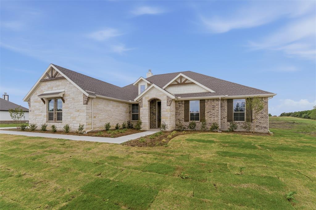 8911 County Road 623 Blue Ridge, TX 75424 - Photo 4 of 28 Craftsman inspired home with stone siding, a chimney, roof with shingles, and a front lawn